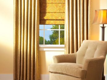 Custom drapery and side panels framing a living room window