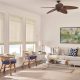 Natural woven shades covering bright living room windows.